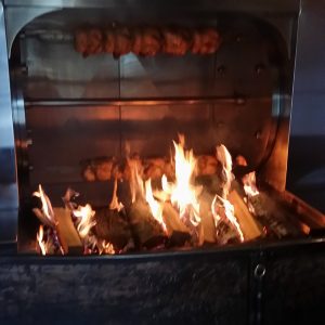 chicken cooking over fire pensacola doodlebuggers