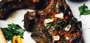 Grilled Bone-In Pork Chops With Garlic Butter